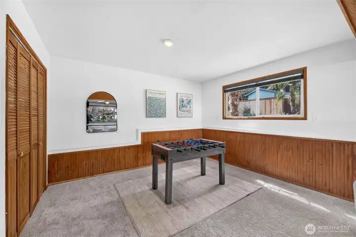 The laundry room is behind the louvered doors to your left in this photo.