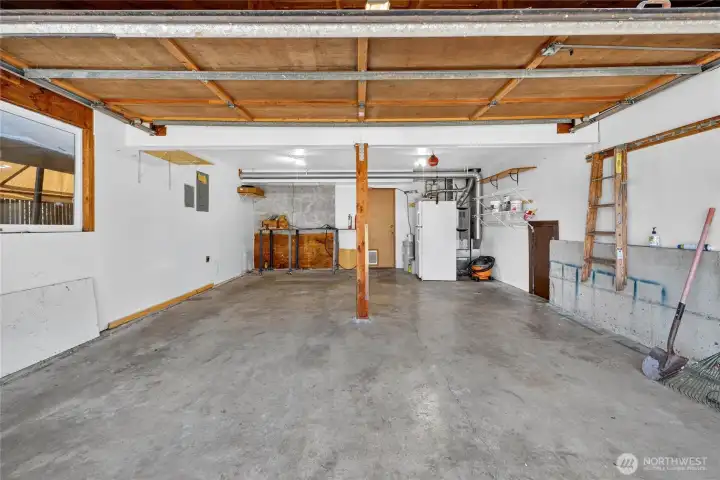 Two Car attached Gaarage.  Plenty of room for extra parking on driveway, and on side of the home, where there is a portable carport, for a parking car, RV or boat.   The extra refrigerator/freezer can stay as well...it works great!