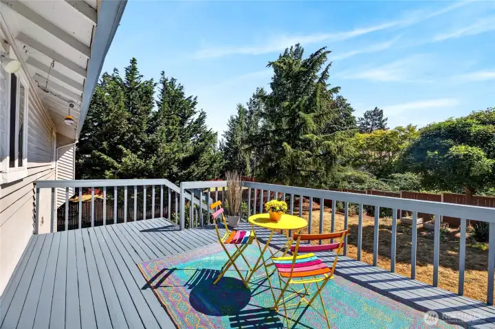 Nice size deck overlooks the backyard and gardens.   Soak in the sun!