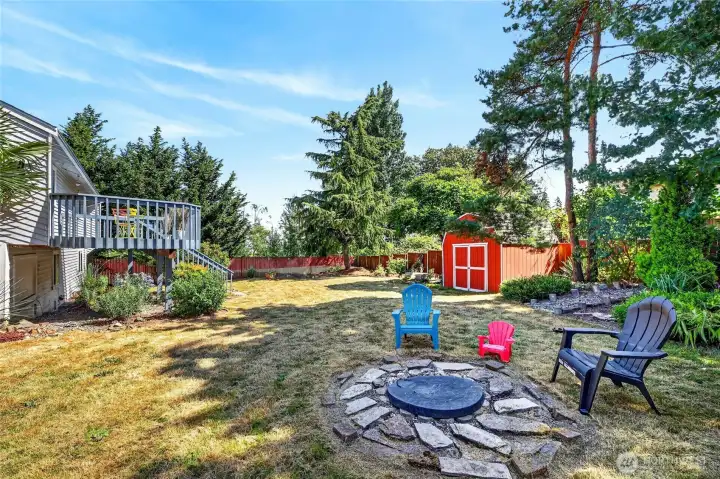 Another grand backyard view.   Plenty of room here for play, games, hanging at the fire pit with a favorite libation..this is a great yard for relaxing - for pets, kids and adults.