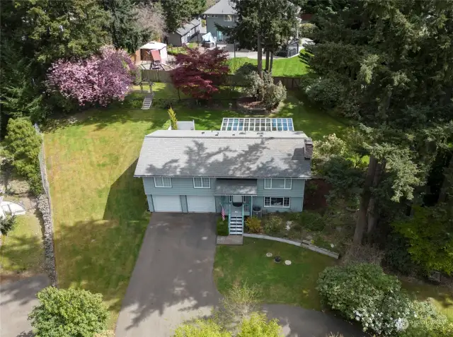 A breathtaking aerial perspective highlighting this remarkable home, boasting a roof that's only 2 years young.