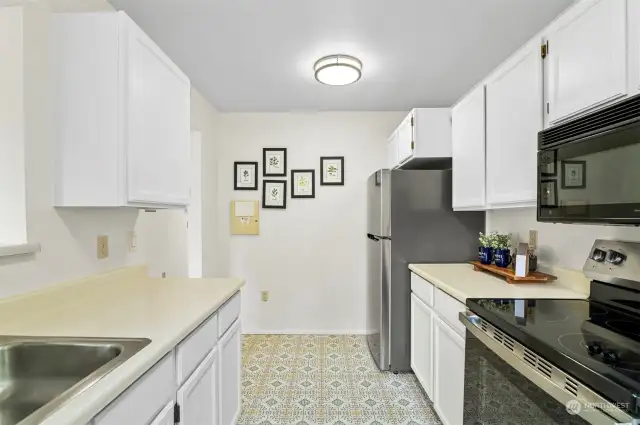 Another View of the Kitchen including New Stainless Steel Appliances.