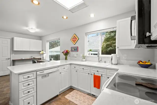 The large windows and a skylight invite light into the kitchen. All windows on this side of the one were replaced last year.