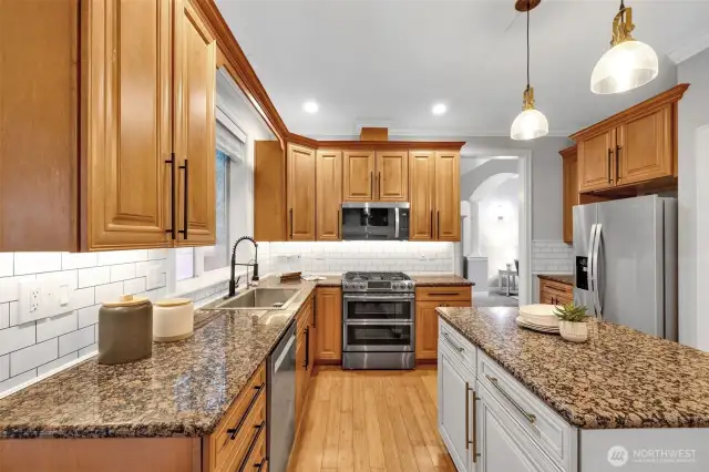 Chef's kitchen with granite counters and new backsplash!