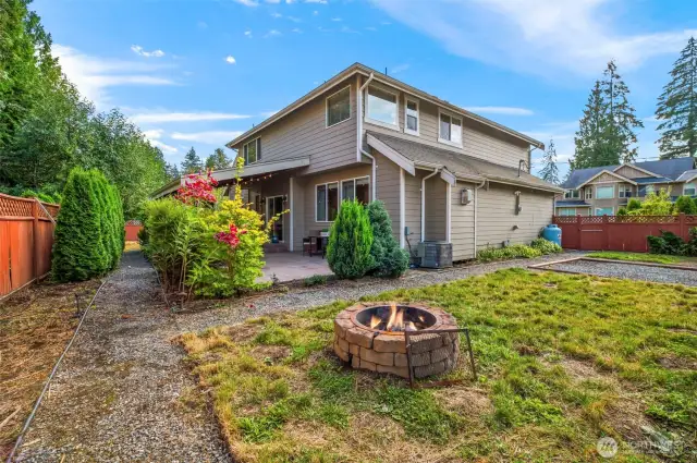 Fully fenced back yard. Don't miss the firepit!