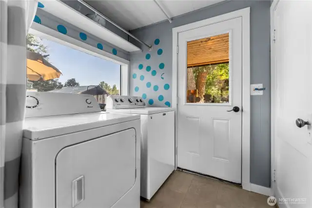 Laundry-mudroom transitions from the covered entry into the kitchen