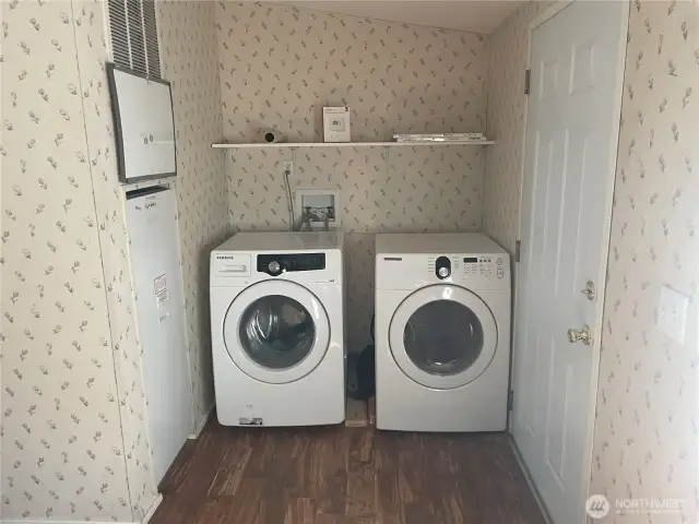 Back door and laundry machines right off the kitchen area.