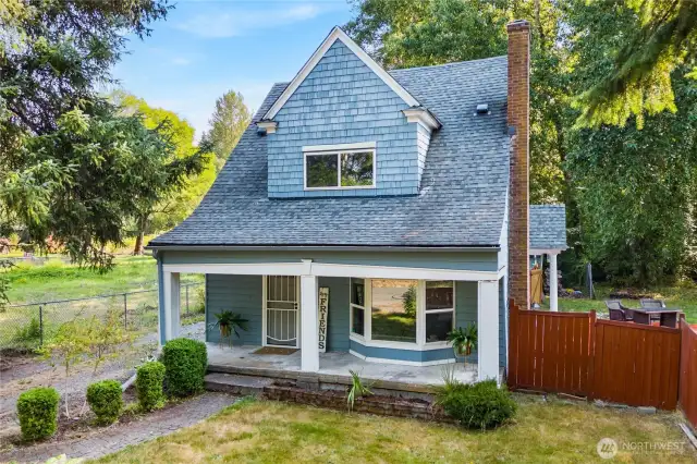 Charming 1915 cottage surrounded by mature trees, offering privacy and character. The large lot provides ample outdoor space, with a fully fenced yard and plenty of room to enjoy.