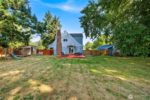 This wide-angle perspective showcases just how much space the backyard provides, perfect for pets, play, or future projects—all within a fully fenced setting.