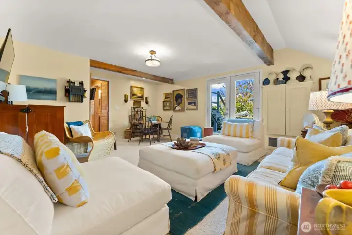 Bonus Sun room looks out french doors to the North deck and fenced garden areas. Super comfortable space.