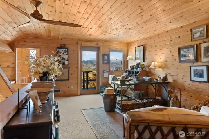 Loft den office has Northern natural light and great space for your computer and library.