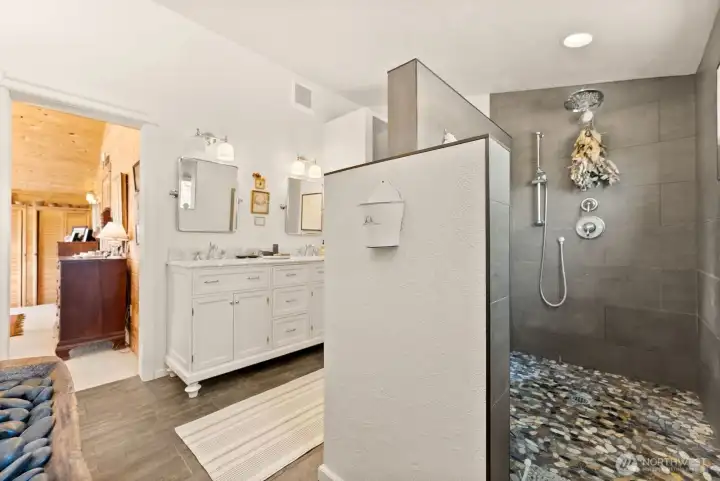 Primary Bedroom Ensuite Bathroom tile stone Shower and double sink vanity.