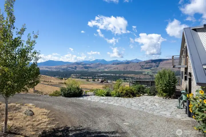 SW views from circular driveway along Montana Blue stone patio.