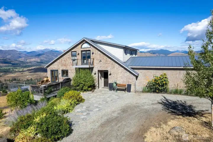 Premiere Luxury 3,637 SF Craftsman in Winthrop. 3 bedroom/ 3 Bathroom on 5 Acres. Sweet Mountain location to savor stunning views from every window. Chefs Kitchen invites inspiration & creativity! Stainless appliances, deep sink, Dekton countertops, Upper open shelving, lower cabinet system. Large storage butler pantry. Dining room setting serves bucolic views, glass doors open to South-facing deck. Great room the enjoys warmth of propane fireplace reflected on Stone hearth at your gatherings, in comfort. Bonus Sun room exudes relaxation and access to North deck Spa & outdoor fireplace. Upper level Primary bedroom ensuite bath includes Laundry and walk-in closet. Loft office/den North balcony and steps to North deck. Walk-out daylight basement has 2 well appointed bedrooms & full bath. Covered outdoor patio. Attached double Garage. Barn. Shop. Garden. Sauna Spa.