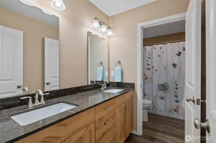 Primary Suite attached full bath has dual sinks