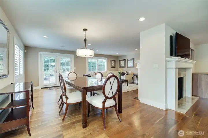 Spacious dining area open to both family and living room. Rarely seen walnut flooring throughout most of main living areas.