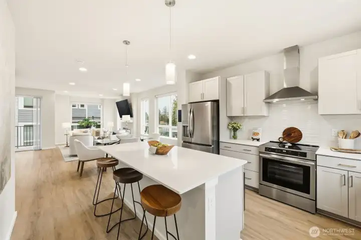 Seamless flow between the living, dining, and kitchen spaces.