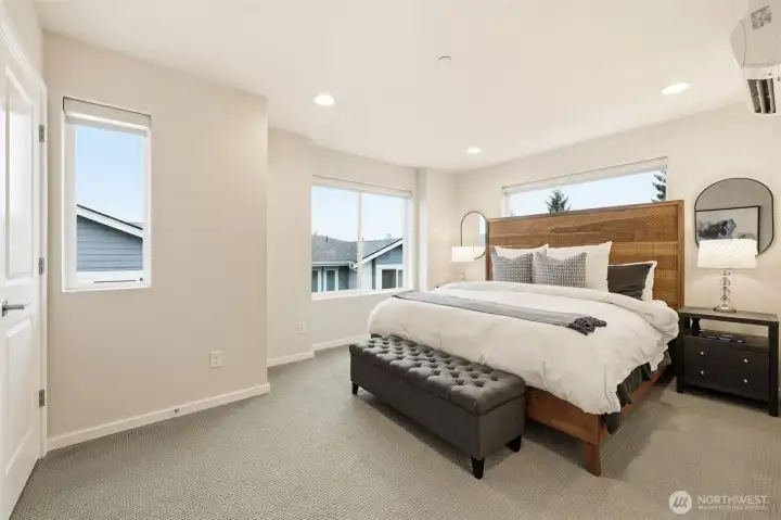 Upstairs retreat featuring a spacious primary suite designed for rest and reset.