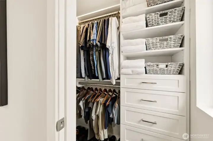 Walk-in closet with custom organization for effortless storage.