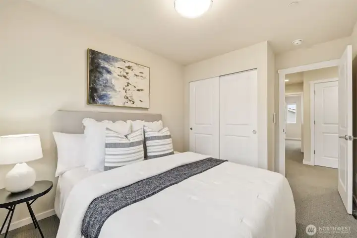 Two additional bedrooms, a full bath, and laundry conveniently located upstairs.