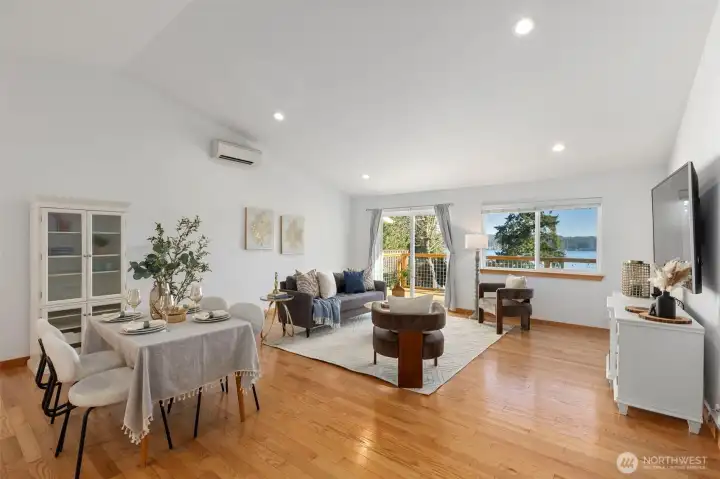 This light-filled residence showcases a dramatic Great room with vaulted ceilings,