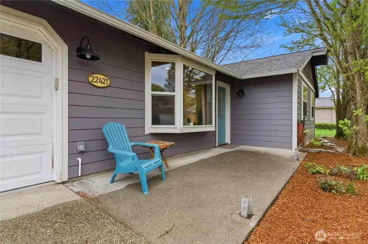 Large front patio with post bases ready to build a cover
