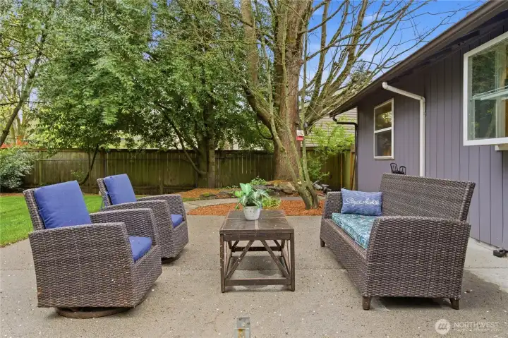 Large back patio with post bases in place to build a cover