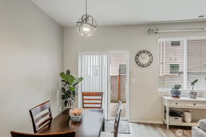 Dining space with modern fixtures. Slider to the fully fenced backyard.