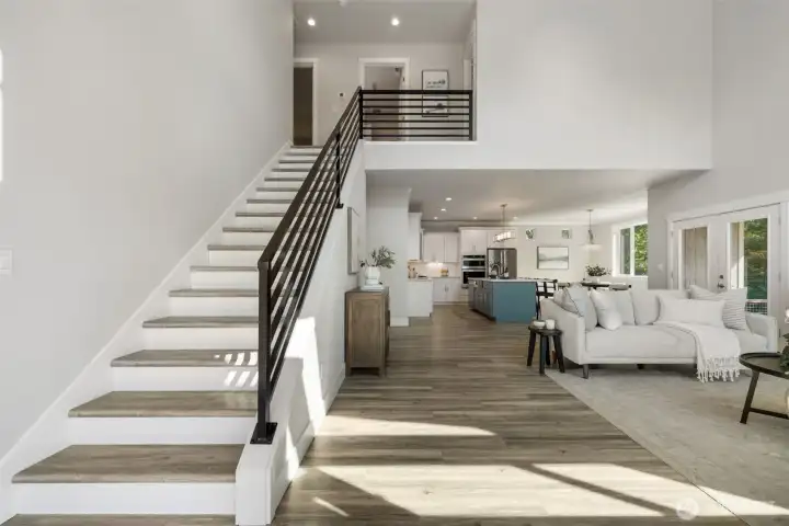 Step in from the front entrance and be welcomed by a ton of natural light and vaulted ceilings