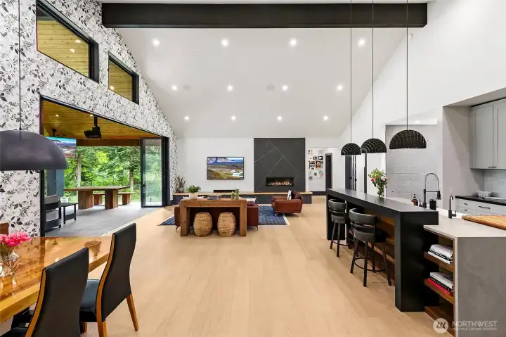 As you open the front door, the 18 feet long Nano Wall glass opening immediately set the tone for the future entertainment options. At the entry, the best feature is the concrete wall, that carries also in the den with that cool black chevron pattern floor. The floors throughout the main level are selected wide plank rift cut and quarter sawn oak. As you open the front door, the 18 feet long Nano Wall glass opening immediately set the tone for the future entertainment options. At the entry, the best feature is the concrete wall, that carries also in the den with that cool black chevron pattern floor. The floors throughout the main level are selected wide plank rift cut and quarter sawn oak.