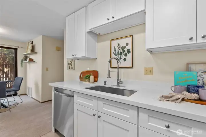 Undermounted kitchen sink with brand new garbage disposal is light and bright and ready for everyday living and cooking. Undermounted kitchen sink with brand new garbage disposal is light and bright and ready for everyday living and cooking.