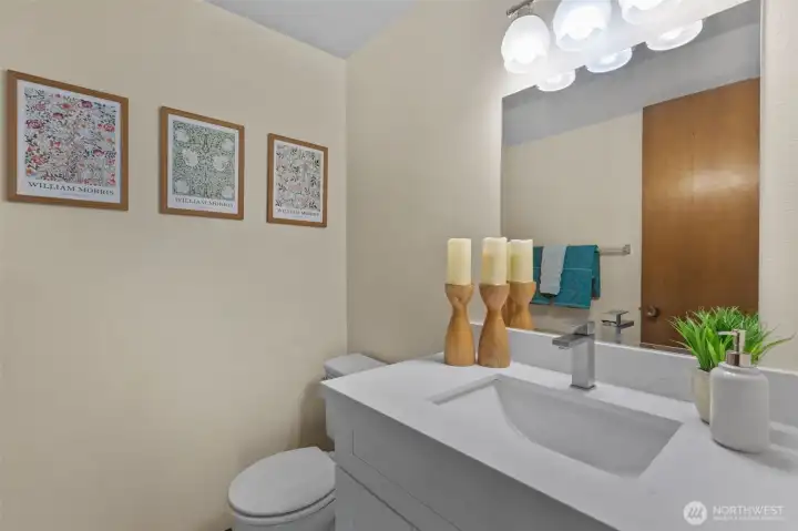 Upper-level half bath complemented by spacious storage room behind bathroom door. Upper-level half bath complemented by spacious storage room behind bathroom door.