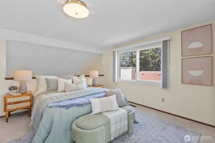 With a large window to and glass slider this upper loft bedroom offers a sunny space year round. With a large window to and glass slider this upper loft bedroom offers a sunny space year round.