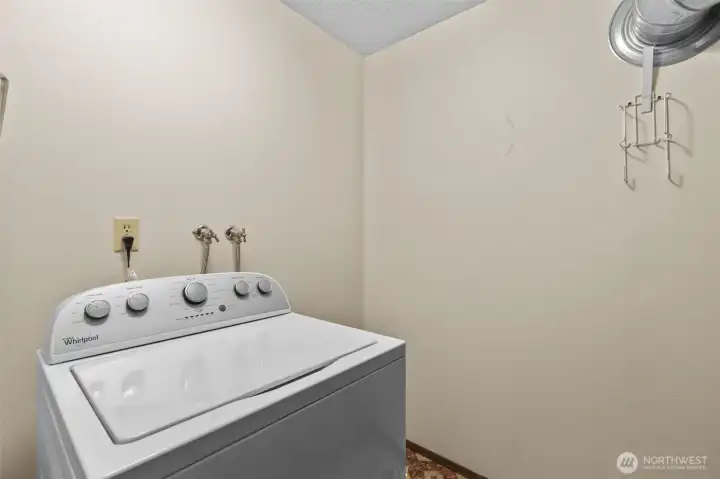 Laundry room conveniently located on the main level across from the bathroom. Laundry room conveniently located on the main level across from the bathroom.