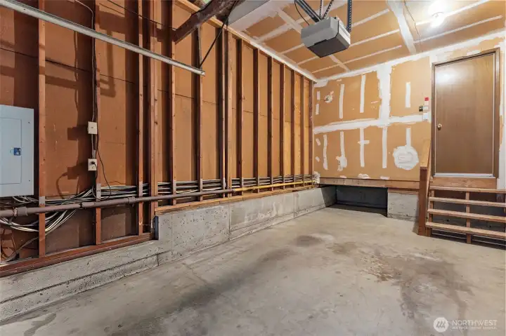Attached garage with tall ceilings offers ample space for a full-size vehicle, plus additional driveway parking Attached garage with tall ceilings offers ample space for a full-size vehicle, plus additional driveway parking