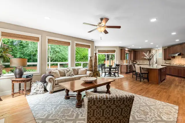 Fabulous family room with a wall of windows overlooking the serene back yard and opens to the kitchen and casual dining area.