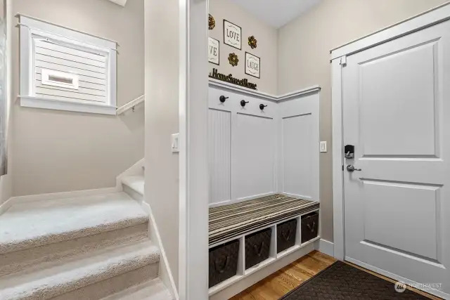 Wonderful Mud Room off the garage with bench seating, storage bins and hooks for hanging. Carpeted 2nd staircase provides an additional access to the upper level.
