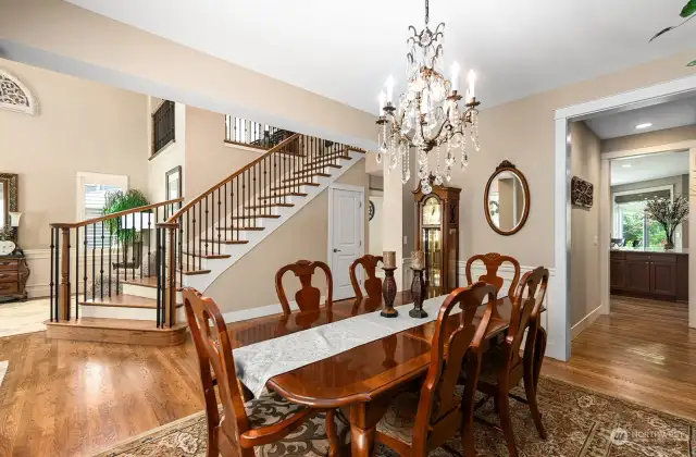 Beautiful open space, highlighting the dining room, entry and gorgeous staircase.