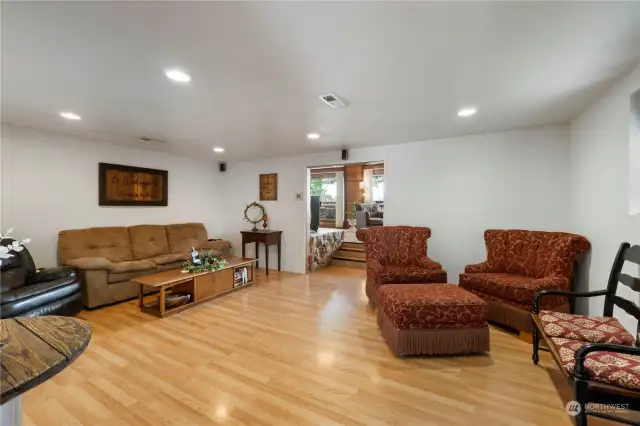 Living room with laminate floors hides real hardwood underneath.