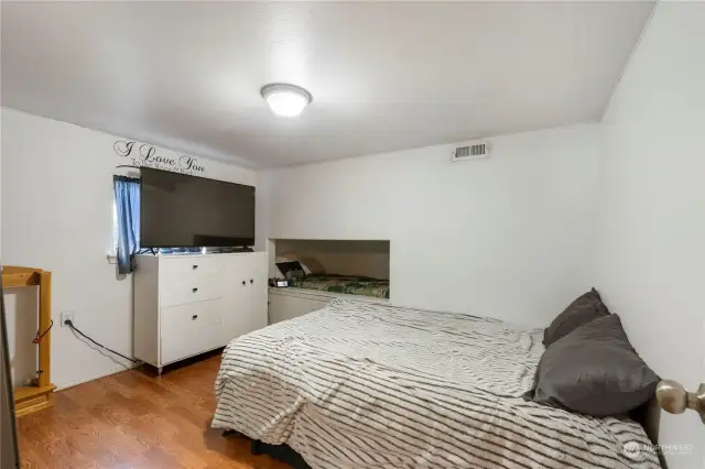 Second guest bedroom with built-in reading nook.