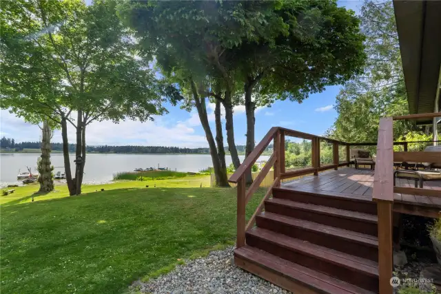 Spacious back deck perfect for enjoying nature & your morning cup of coffee.