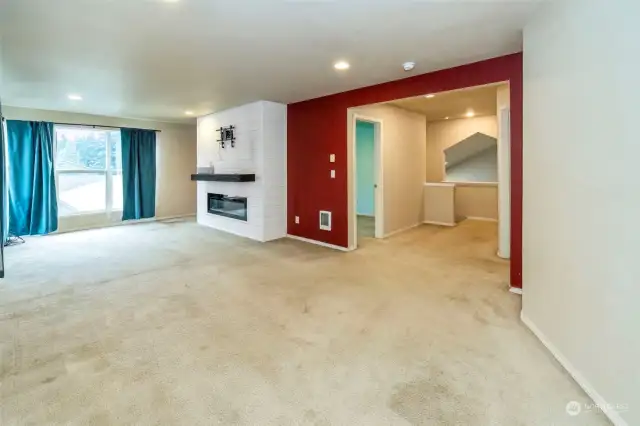 Loft space with electric fireplace.