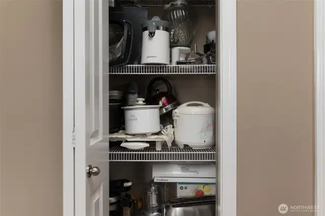 Another kitchen cabinet across from island.