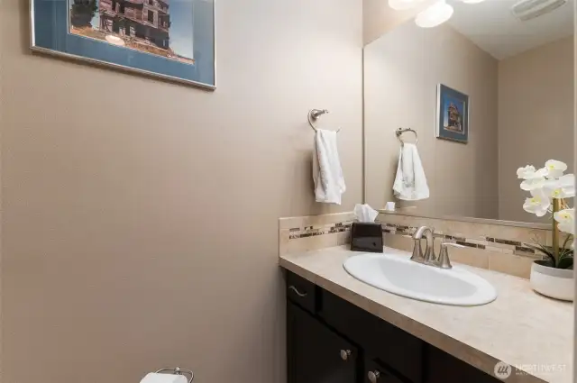 Half bath, close to main floor & garage activites.