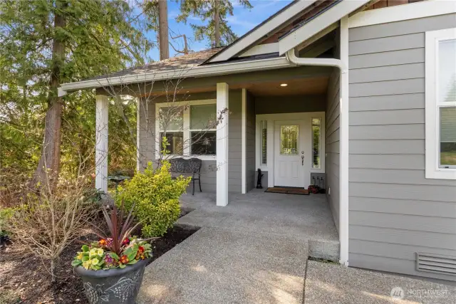 Welcoming covered front porch. Accessible entry with no steps from the driveway.