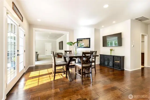 Sitting/dining area features a cozy gas fireplace.