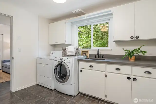 Lower level laundry. Ample space to create secondary kitchen.