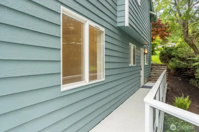 Lower level entrance. Accessible from the front of house via stone path.
