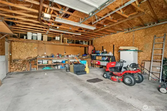 This shop is set up for convenience with 9’ garage doors that fit your tallest truck, an automatic opener so you don’t have to roll down the window, and a side door for convenient exits. Riding mower stays too!