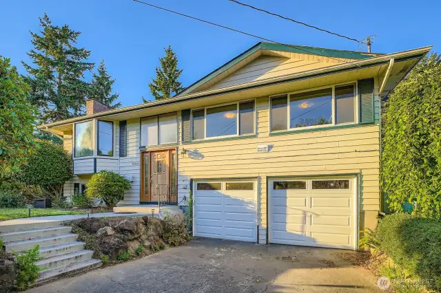 Two bay oversize garage with backyard people door access and window